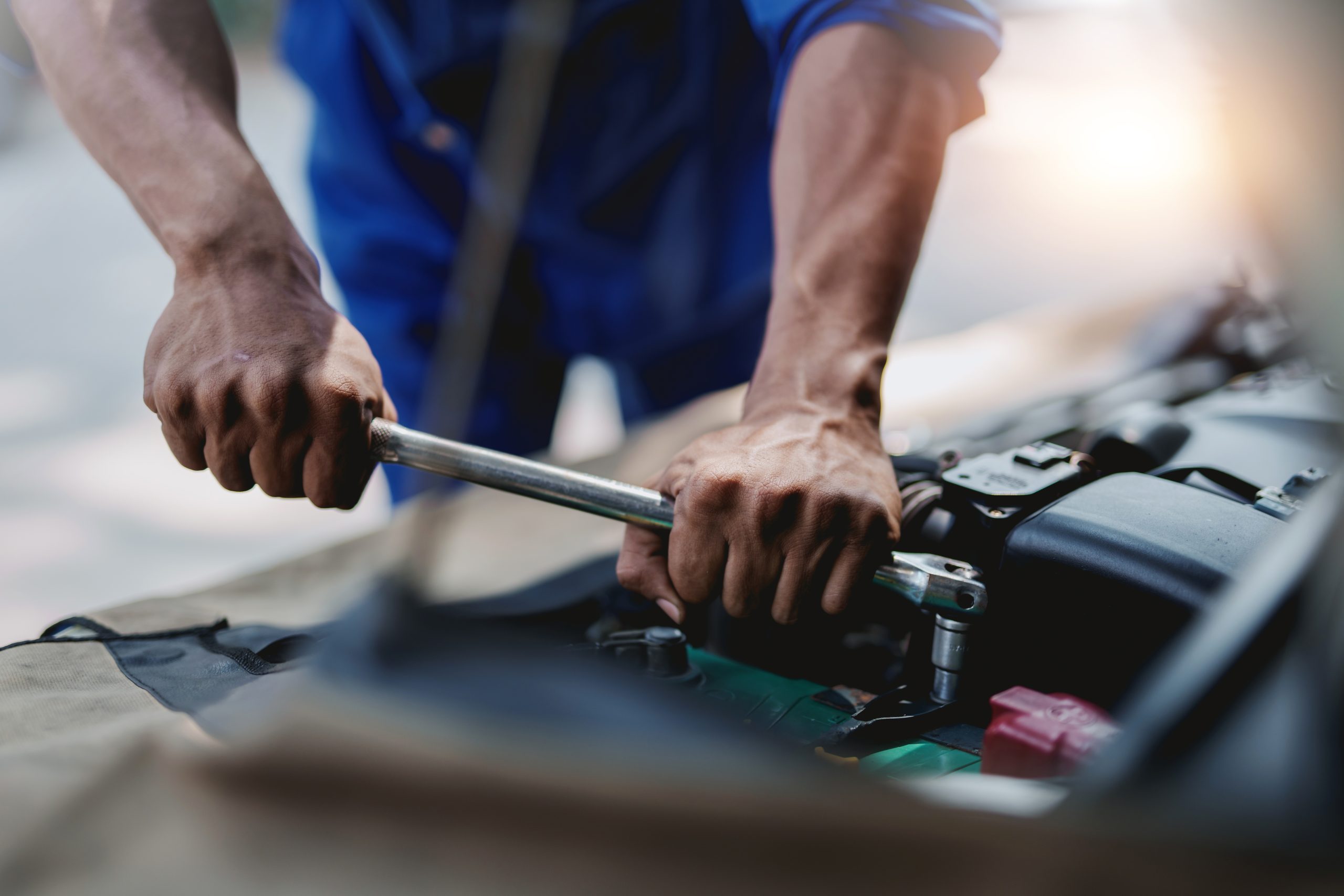 Repair shop technician working on a vehicle